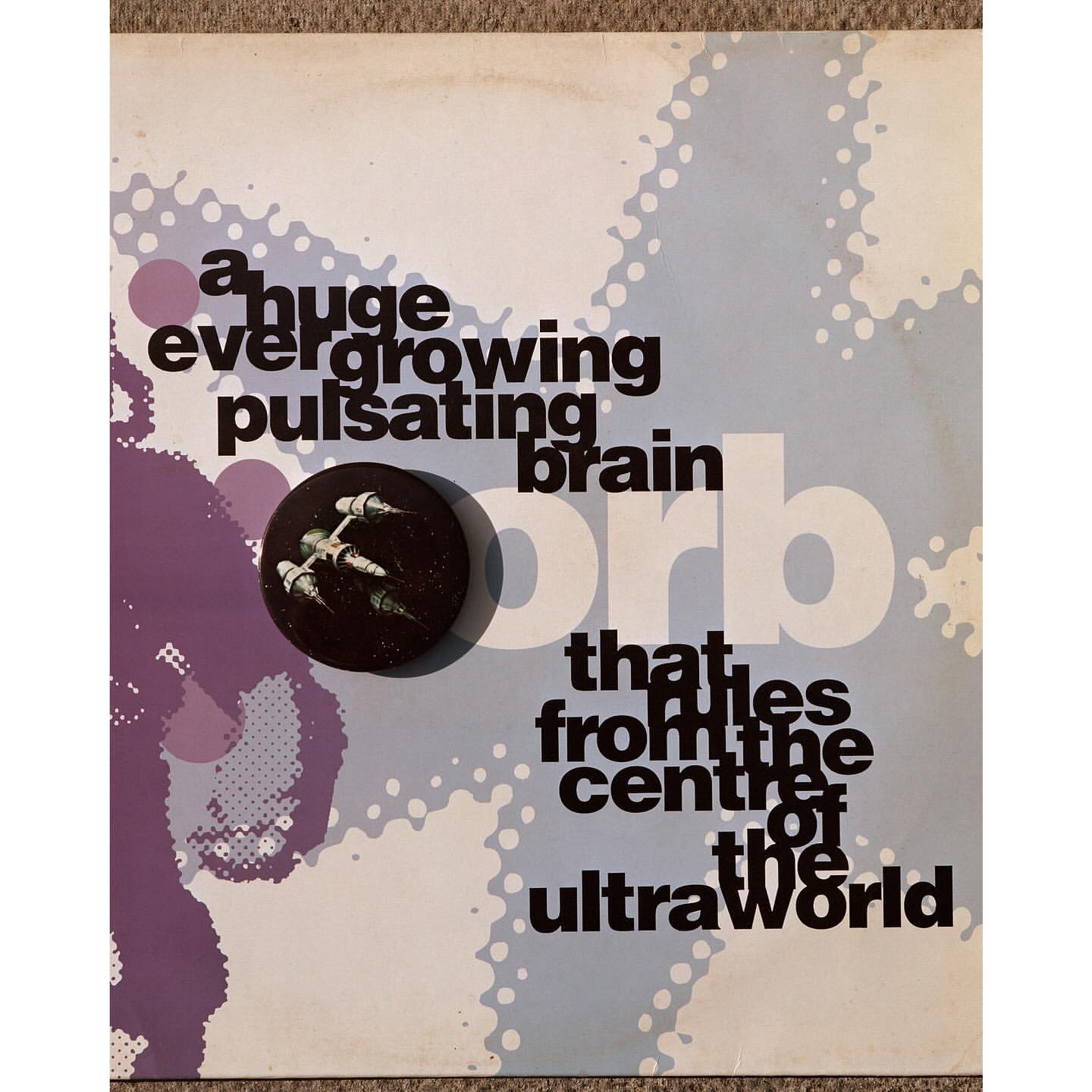 Album cover art with text reading, 'a huge ever growing pulsating brain orb that lies from the centre of the ultra world'.