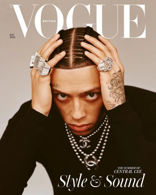 British Vogue cover featuring Central Cee with braids, rings, and layered necklaces in a close-up shot against a neutral background.