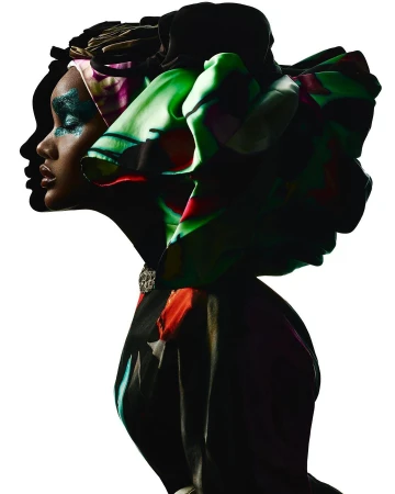 Profile portrait of a Black model with glittering teal eyeshadow wearing a vibrant patterned silk headwrap against a bright white background