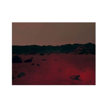 Martian landscape with a red surface, dark hills in the background, and a reddish-brown atmosphere. Rocks are scattered.