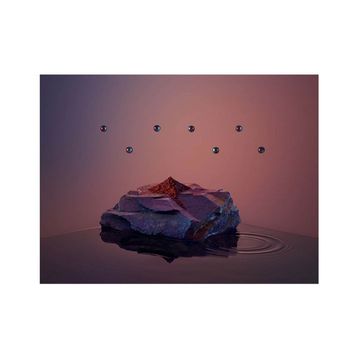 Still life featuring a rock formation with red powder on top, droplets floating above a reflective dark surface, and a gradient background.