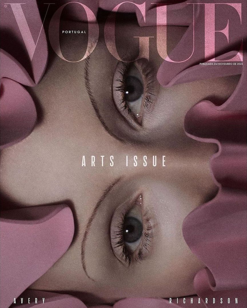 Vogue Portugal cover featuring a close-up of a face with eyes looking upward, surrounded by pink floral elements, and magazine text.