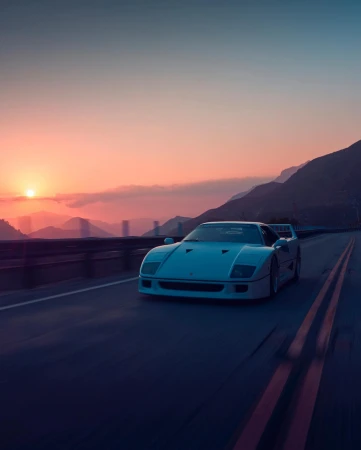 White Ferrari F40 driving on a winding road at sunset with mountain views, capturing an automotive lifestyle aesthetic.