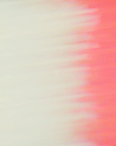 Blurred abstract background with blended shades of cream and coral creating a soft, dreamy effect, suitable for backgrounds.