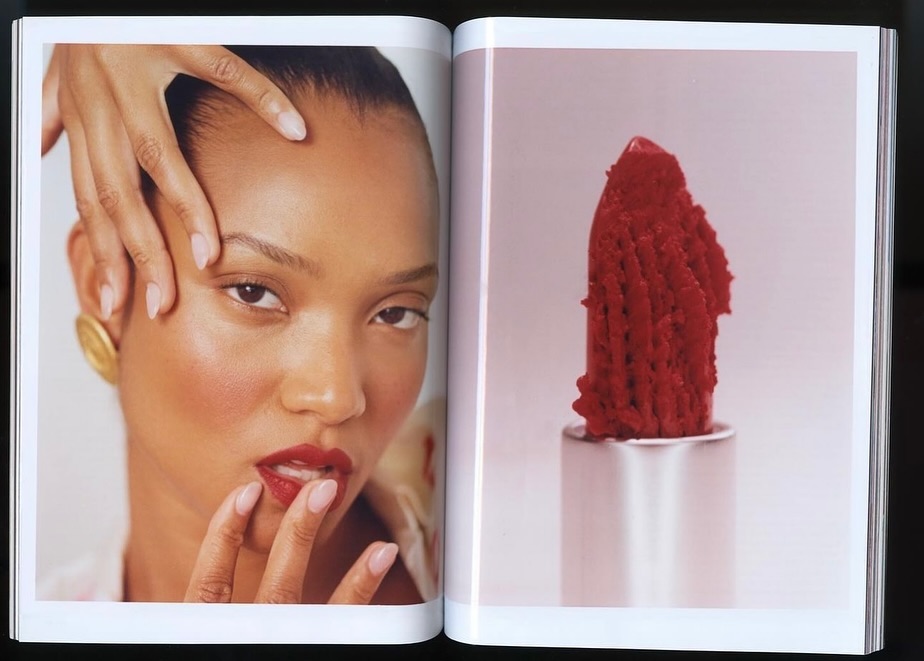 Close-up of a biracial woman in a beauty editorial with red lipstick next to an extreme close-up of red lipstick in a silver tube.