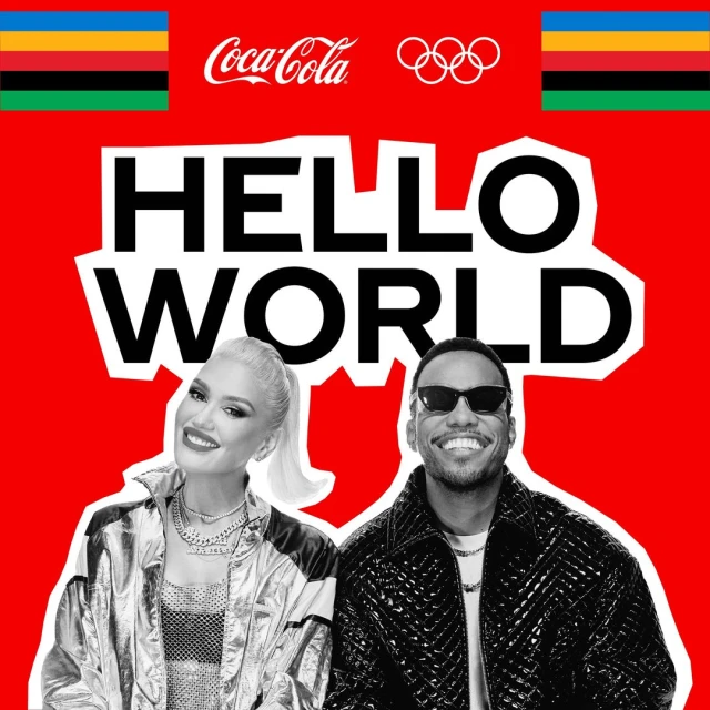 Gwen Stefani and a smiling man in sunglasses pose against a Coca-Cola Olympic ad backdrop in this vibrant promotional image.