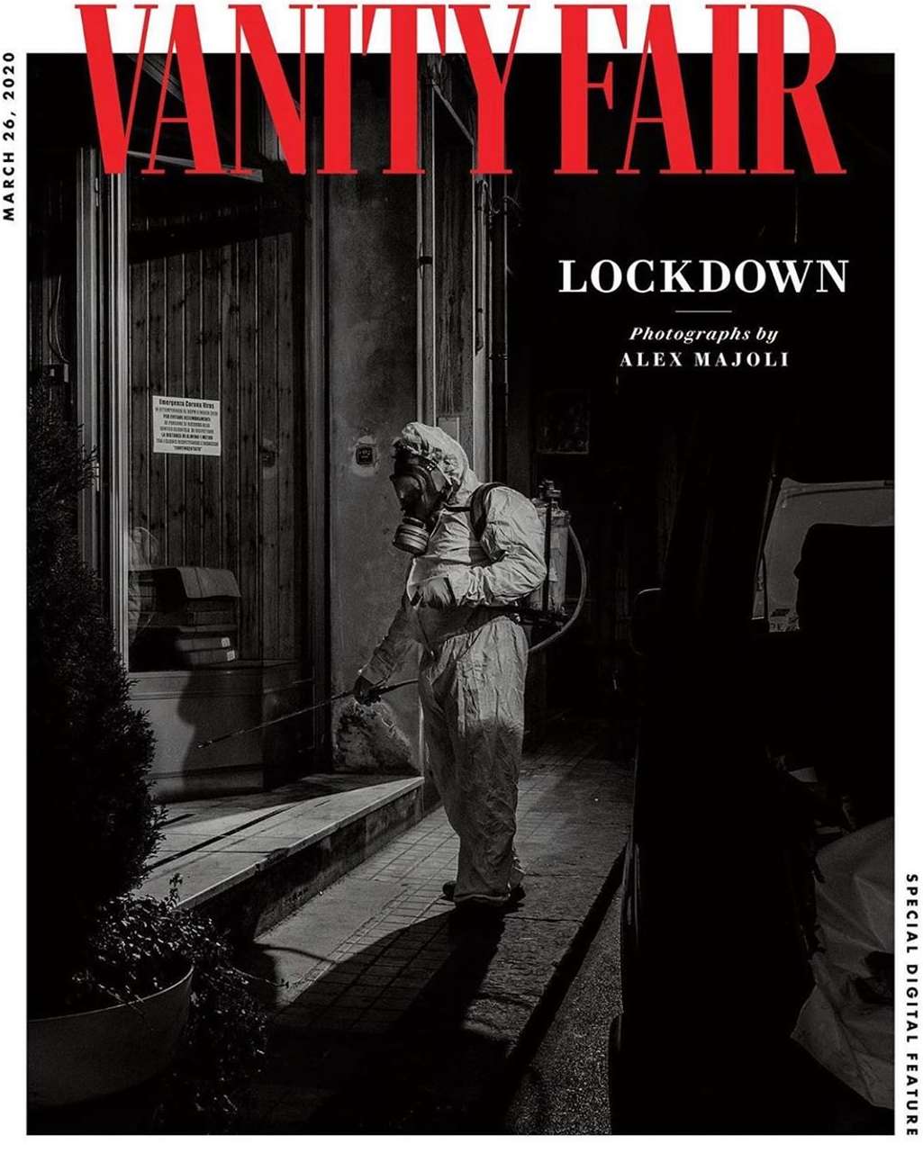 Vanity Fair magazine cover with a person in a hazmat suit disinfecting steps, March 26, 2020 issue with 'Lockdown' headline.