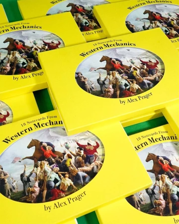 Multiple yellow boxed sets of Western Mechanics notecards by Alex Prager piled closely together