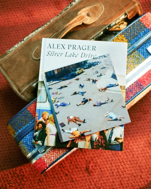 Alex Prager's 'Silver Lake Drive' book displayed with handbags, highlighting fashion photography and book design in a studio setting.