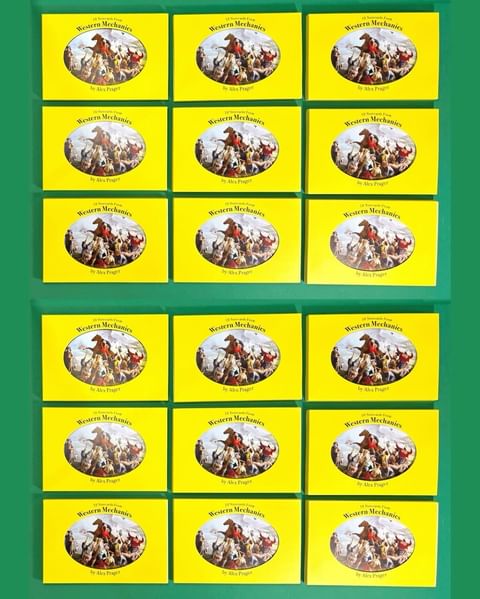 Multiple yellow boxes with a vintage Western illustration of cowboys riding horses in a group, arranged neatly on a green background.