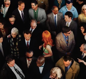 High-angle crowd shot of diverse people in mid-century attire tightly packed together by photographer Alex Prager