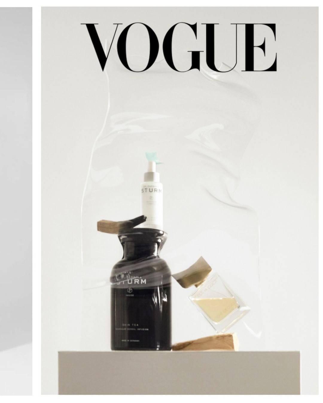 Still life shot of skin care products on a pedestal against a white background with 'Vogue' logo for a beauty editorial.