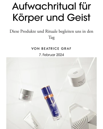 Still life of skincare products, including creams and serums, arranged on a glossy white surface with neutral lighting. Beauty concept.