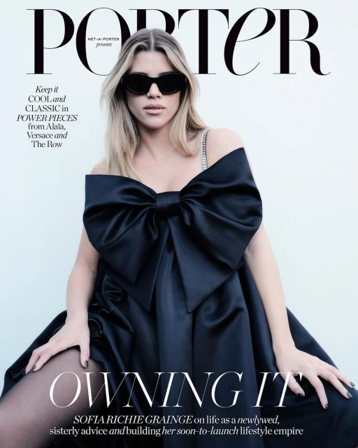 Magazine cover featuring Sofia Richie Grainge wearing a black off-the-shoulder gown with a large bow and black sunglasses against a white backdrop.