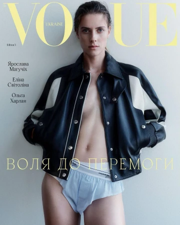 Vogue Ukraine cover featuring a solo adult female model wearing a black leather jacket and light blue underwear, posing in a photo studio.