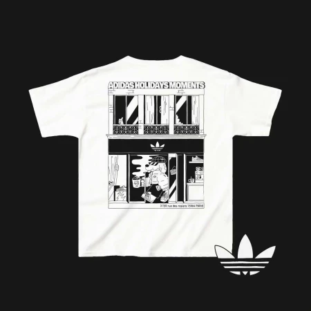 Adidas t-shirt featuring a black and white cartoon drawing of a building facade with a figure standing in front of it.
