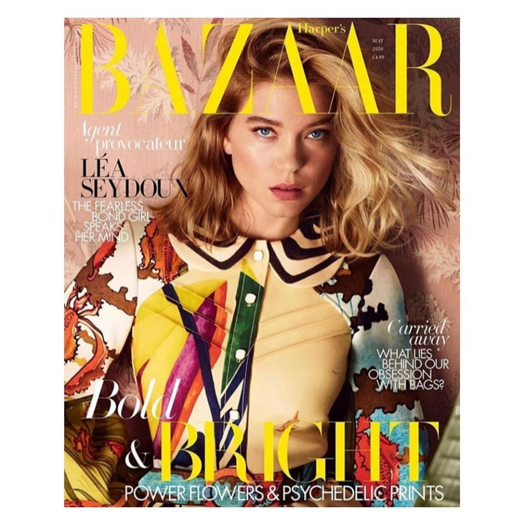 Harper's Bazaar magazine cover featuring Léa Seydoux, with bold yellow title text and multicolored floral patterns on her dress.