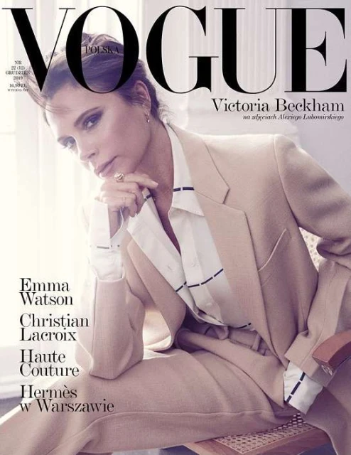 Vogue Polska cover featuring Victoria Beckham in a tan suit, seated indoors, with the magazine's logo and headlines visible. Fashion editorial.