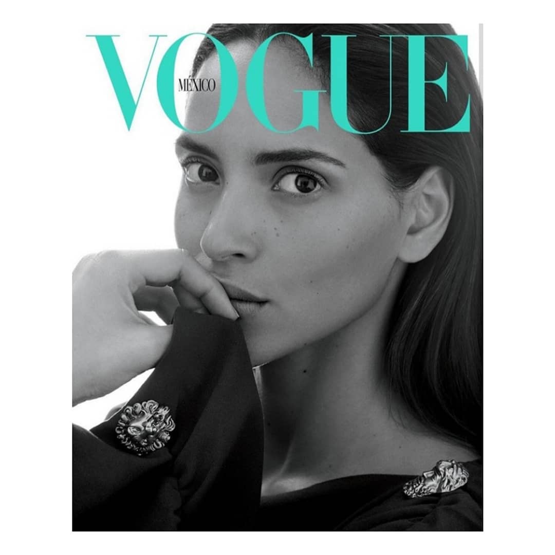Vogue Mexico cover featuring a close-up portrait of an adult female model with hand near her face, styled in a black top with lion embellishments.