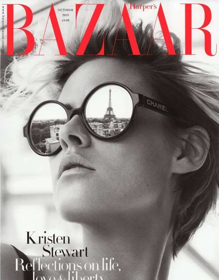 Black and white fashion magazine cover featuring a woman with sunglasses reflecting the Eiffel Tower in Paris, France.
