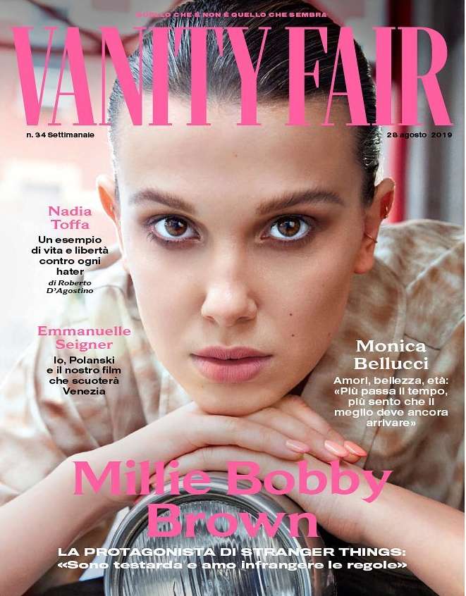 Magazine cover featuring a close-up portrait of Millie Bobby Brown. 'Vanity Fair' logo at the top, various text elements, and a vintage motorcycle detail.