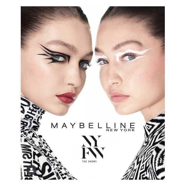 Cosmetics ad featuring two women side-by-side with artistic black and white eye makeup and black and white graphic print clothing.