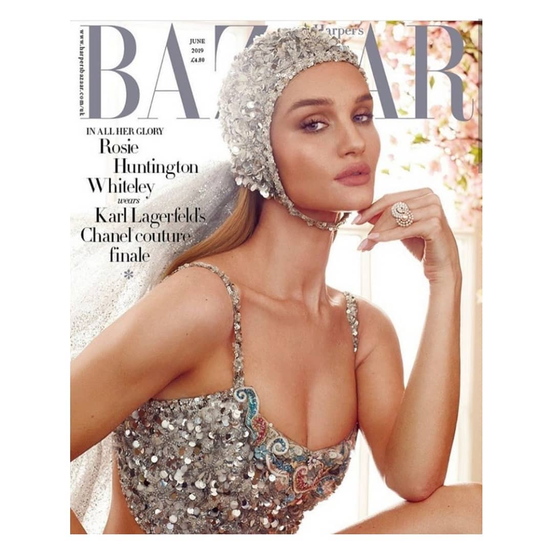 Rosie Huntington-Whiteley magazine cover, June 2019 Harper's Bazaar, wearing a sequined cap and dress with an ornate ring.