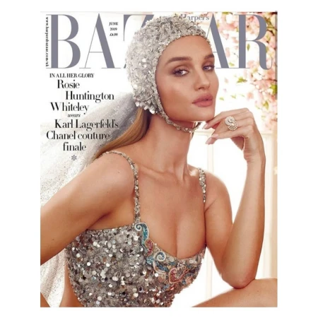 Rosie Huntington-Whiteley magazine cover, June 2019 Harper's Bazaar, wearing a sequined cap and dress with an ornate ring.