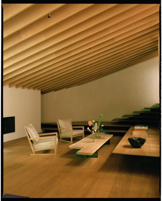 Living room interior with light wood floors, ceiling, and furniture; a light, neutral palette, and minimalist design. Modern decor.