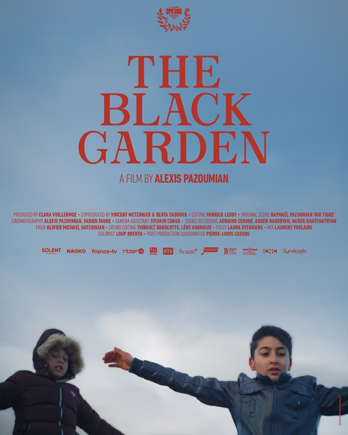 Movie poster for 'The Black Garden' featuring two children standing in front of a cloudy sky, with the title prominently displayed above.