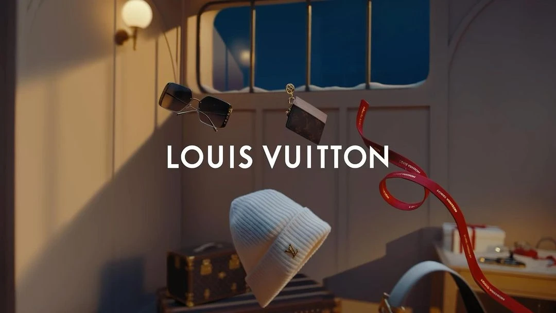 Louis Vuitton fashion scene featuring a beanie, sunglasses, a wallet, and a red ribbon, showcasing luxury accessories and brand recognition.