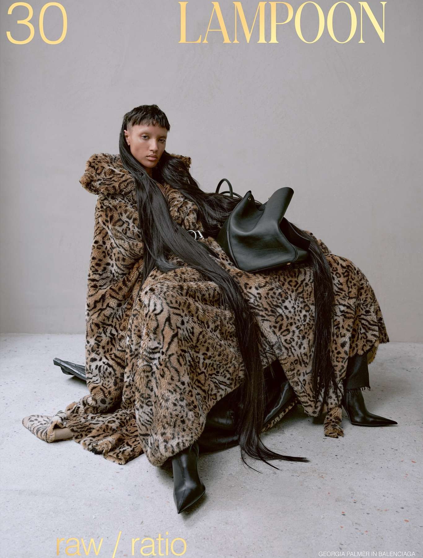 Fashion editorial featuring a woman draped in a leopard-print garment, seated with a black leather handbag, showcasing edgy style.