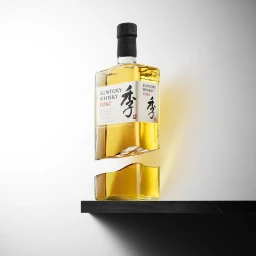 A split glass bottle of Suntory Toki whisky resting on a dark shelf against a gradient grey background