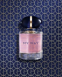 Giorgio Armani My Way perfume bottle against a patterned blue and gold geometric background.
