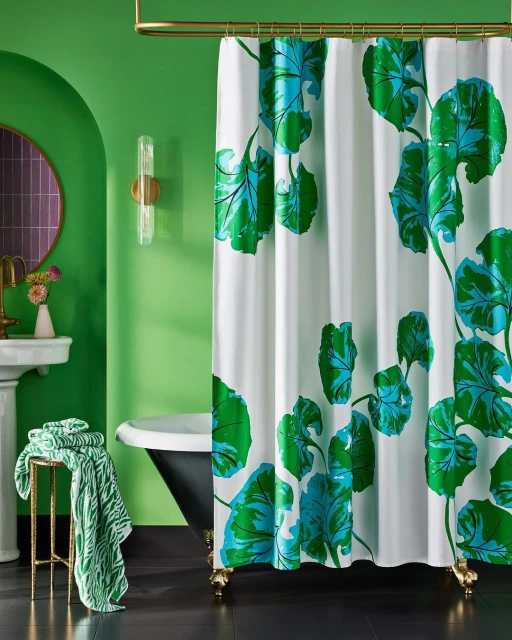 Bathroom interior features a clawfoot tub, a green accent wall, and a shower curtain with a bold green and blue leaf pattern.