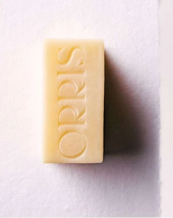 Rectangular bar of Orris soap against white backdrop. The soap is off-white with the brand name embossed on its surface.