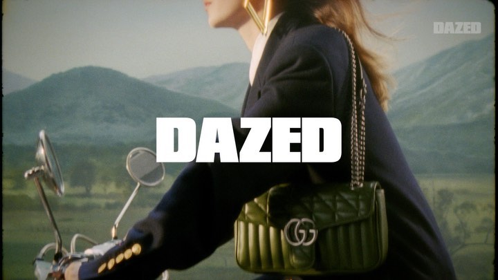 Fashion editorial shot: Woman on vintage scooter with Gucci purse against a backdrop of soft, rolling hills and magazine cover.