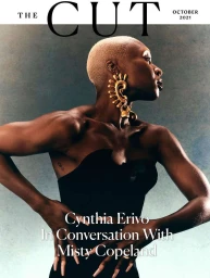 Cynthia Erivo wearing a black strapless top and large gold ear cuff against a textured background by Amber Pinkerton