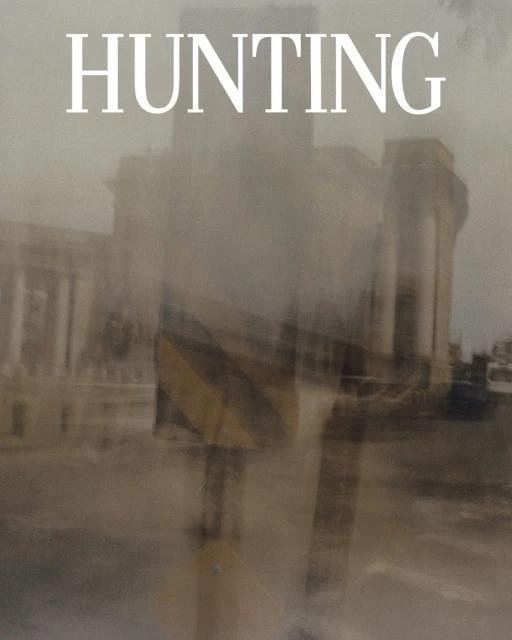 Cityscape with blurred figures and vintage filter, featuring aged buildings and the word 'HUNTING' in bold letters.