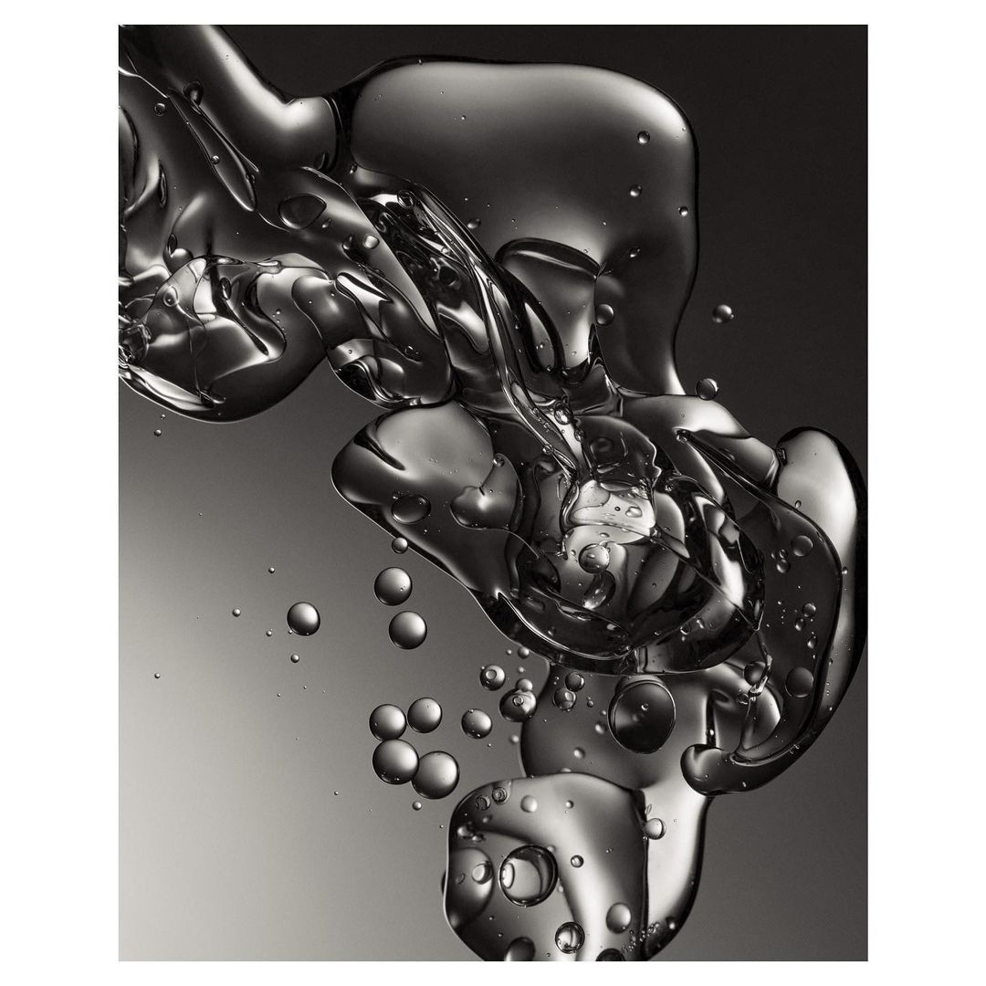 Abstract liquid forms a fluid background with gray color gradients and bubbles. Abstract, fluid concept for graphic design or cosmetics.