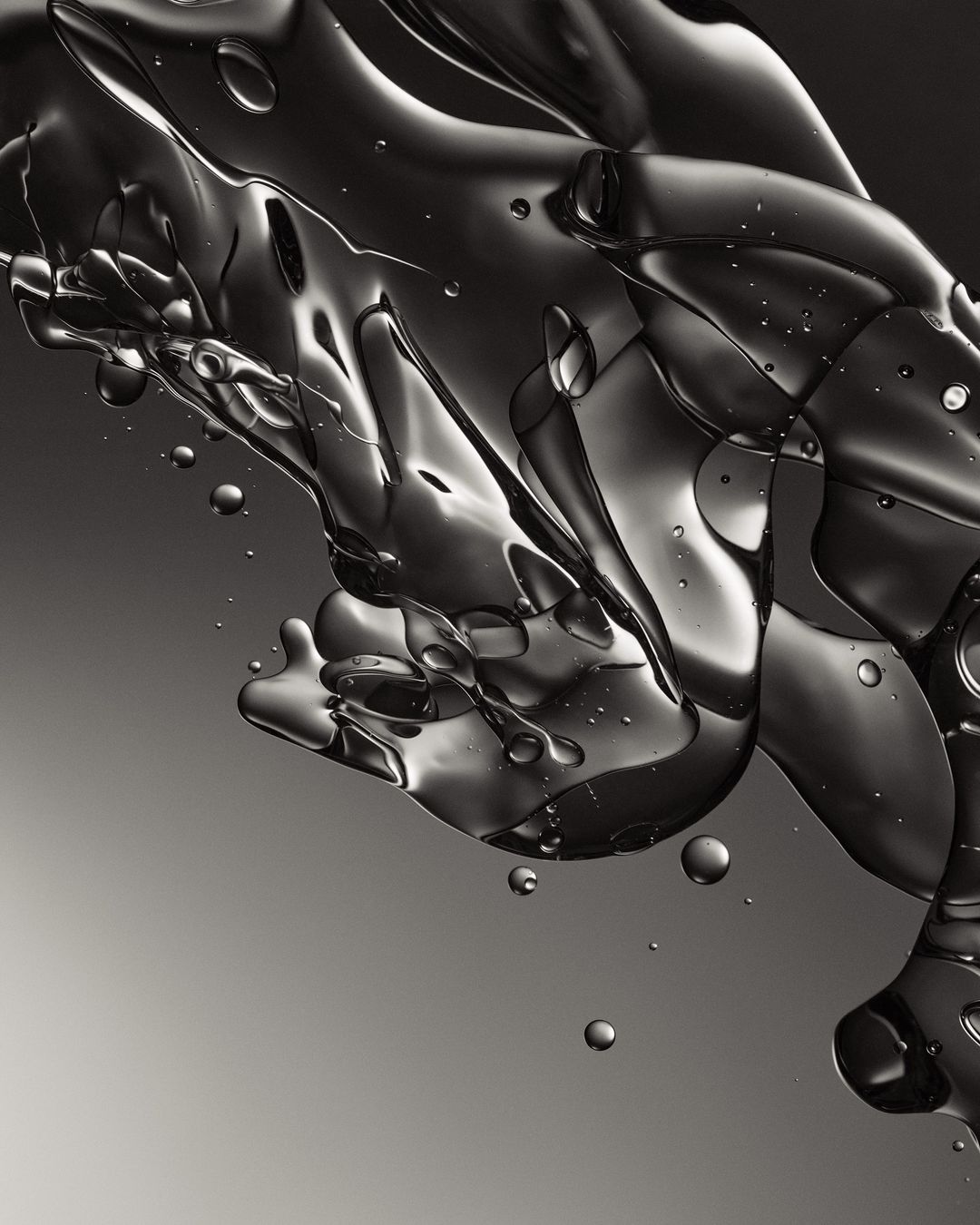 A close-up photograph of liquid, capturing its translucent properties and intricate patterns against a gray gradient backdrop.
