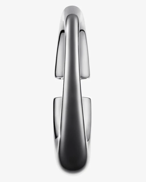 Close-up studio shot of a sleek, modern metal water faucet with a curved spout and reflective surface, set against a plain white background.