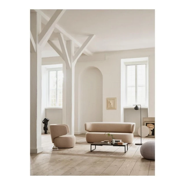 Living room interior with beige sofa and armchair, modern design, neutral color palette, natural light, wooden floor, minimalist style.
