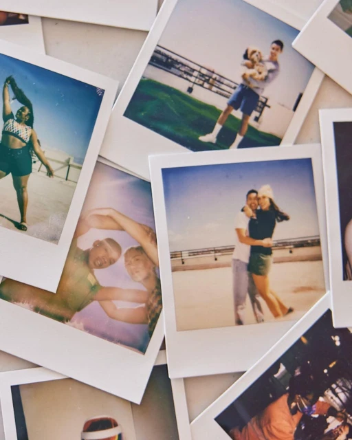 Collection of polaroid photos featuring couples, a man with a dog, and a woman in swimwear, displayed on a white surface.