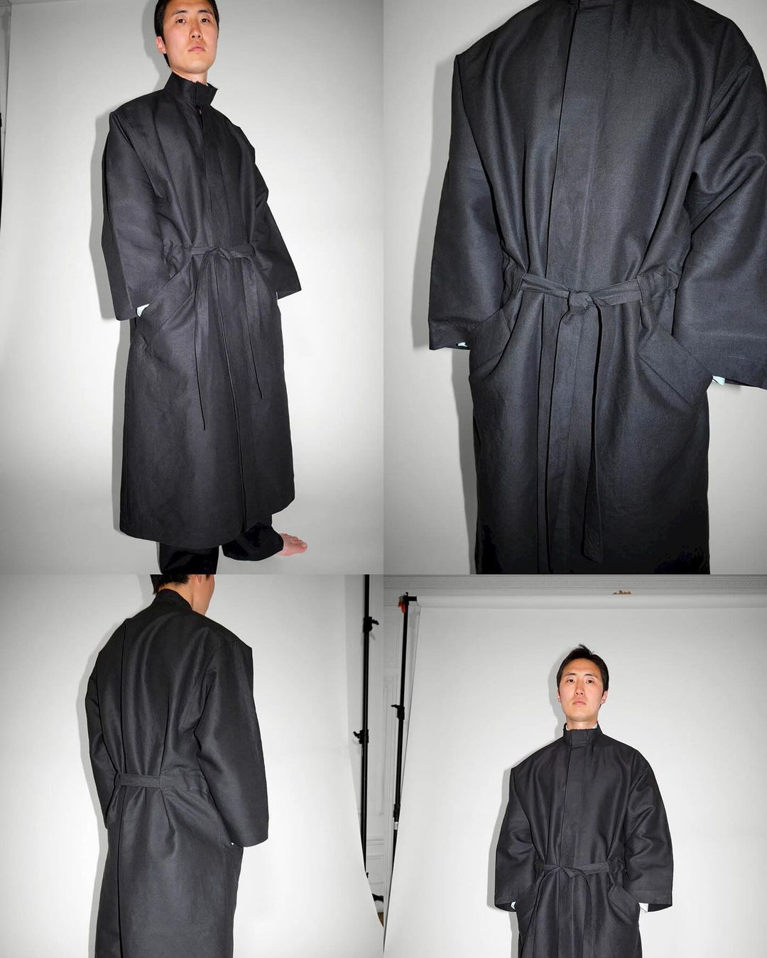 Person wearing a long, dark, belted coat in a photo studio setting. The images show the coat from the front and back on a light background.