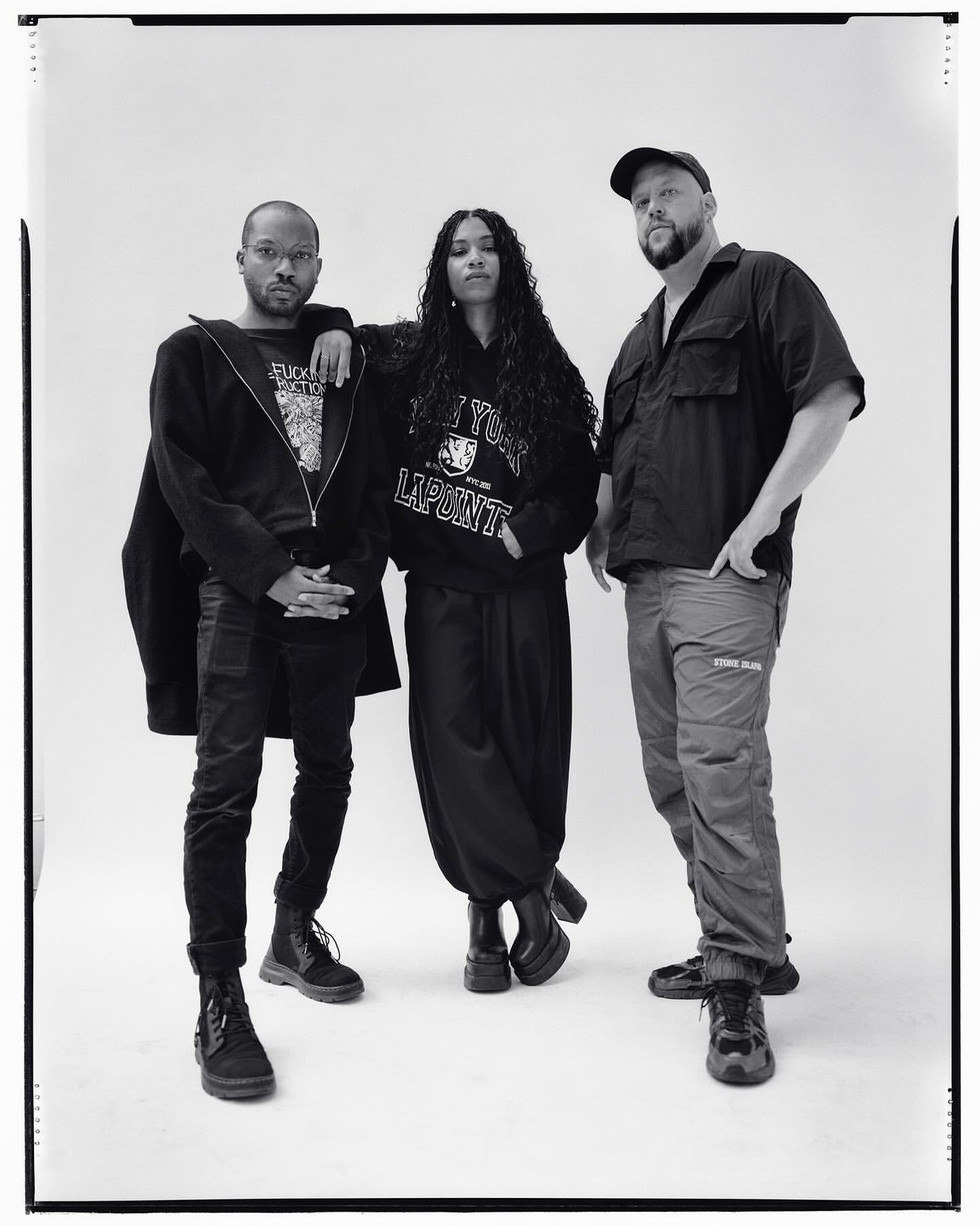 Portrait of three people standing against a white backdrop, photographed by Andreas Laszlo Konrath in New York.