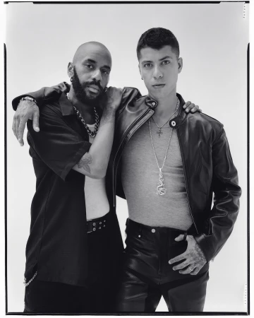 Portrait of two men posing together against a plain white seamless studio background in New York by Andreas Laszlo Konrath.