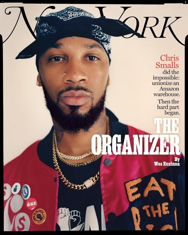 Magazine cover featuring an adult male wearing a bandana and red jacket with gold chains, staring directly at the viewer. Head and shoulders.