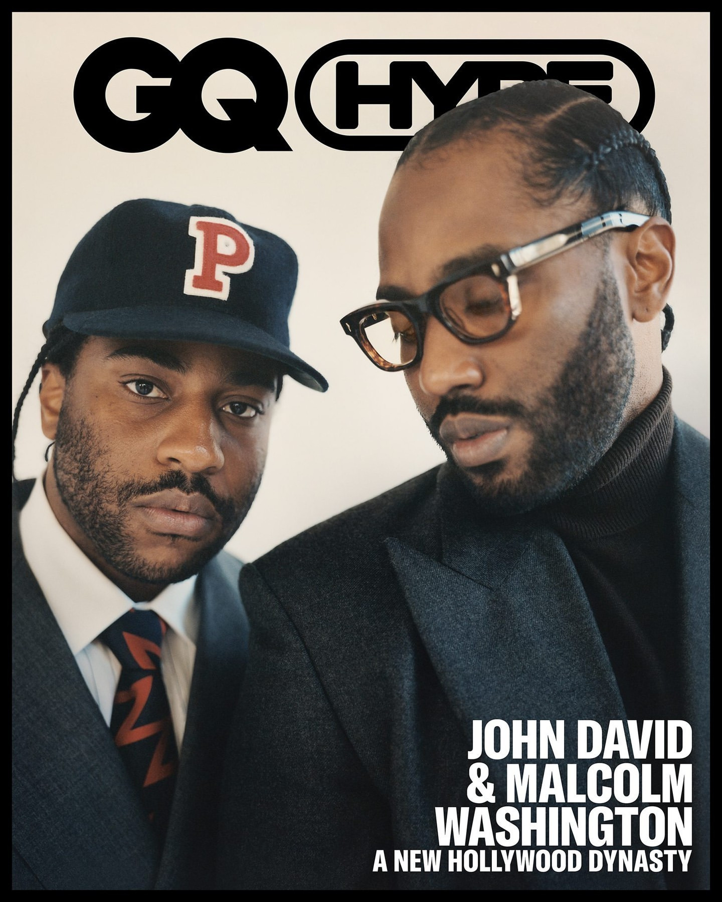GQ cover featuring John David and Malcolm Washington, brothers, in a close-up shot, wearing a blazer and cap in a photo studio setting.