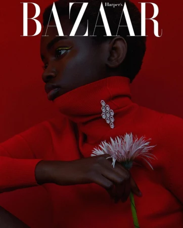 Fashion magazine cover featuring a Black woman in a red turtleneck sweater, holding a daisy, with 'BAZAAR' text overlay.